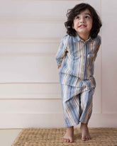 laad`s Kids' striped co-ord set with a long-sleeve shirt and shorts, featuring soft beige and gray tones. Embroidered seahorse detail adds a playful touch. Lightweight, breathable fabric for all-day comfort.